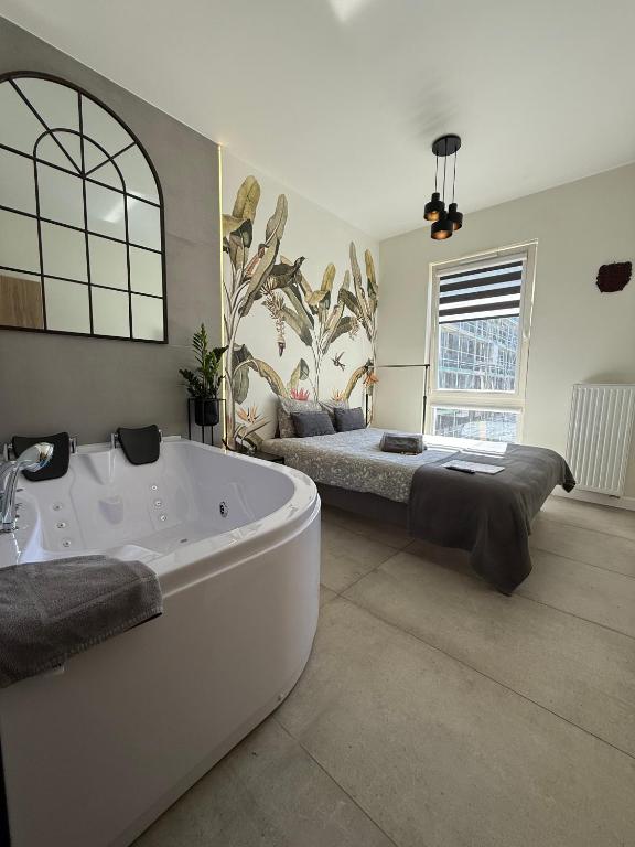 Posteľ alebo postele v izbe v ubytovaní Jacuzzi Apartamenty Gdańsk - RELAX Apartments