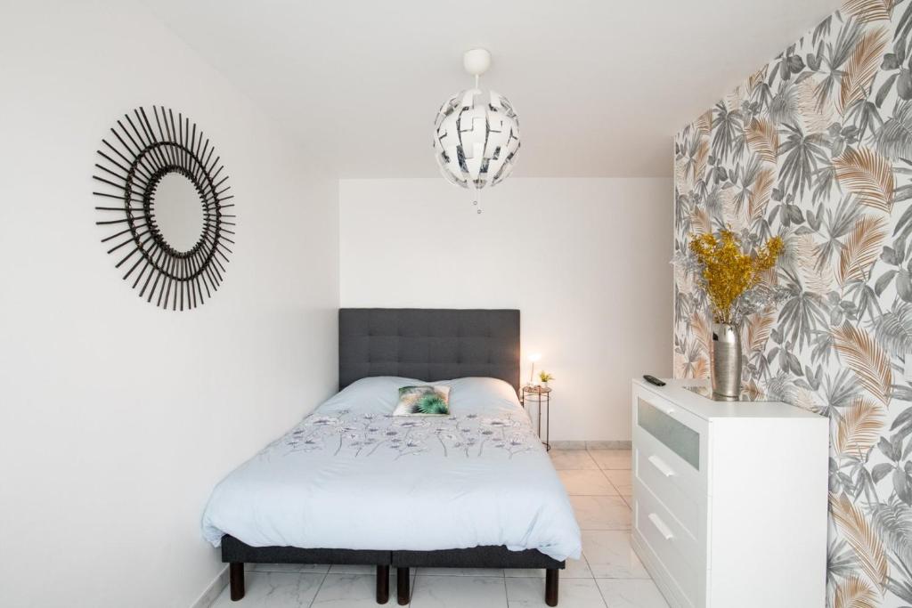 Łóżko lub łóżka w pokoju w obiekcie Le Jasseron - Appartement cosy avec garage quartier PartDieu