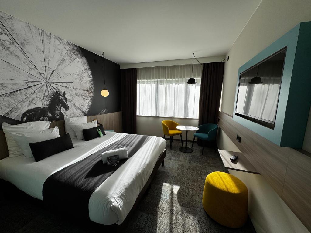 Postel nebo postele na pokoji v ubytování Hotel & Aparthotel Casteau Resort Mons Soignies