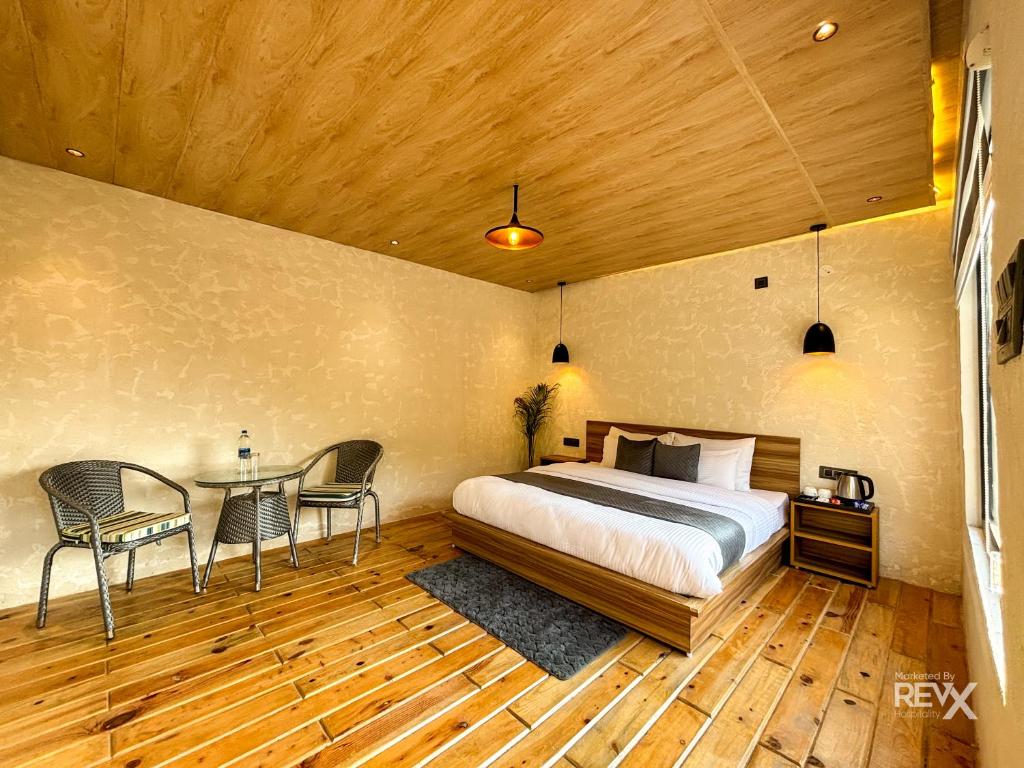 Postel nebo postele na pokoji v ubytování Anupraas Resort