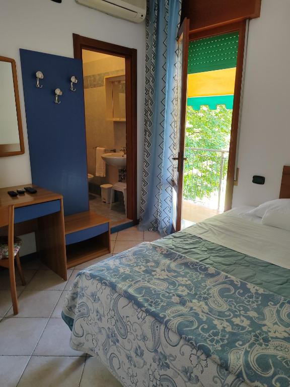 Postel nebo postele na pokoji v ubytování Hotel Trifoglio