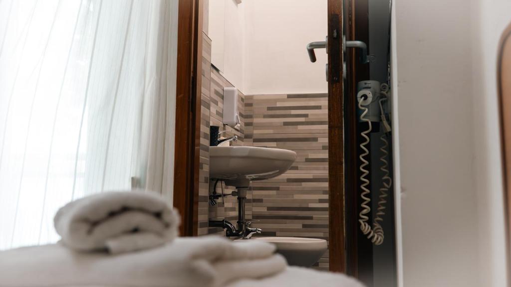 Koupelna v ubytování Hotel Fattori