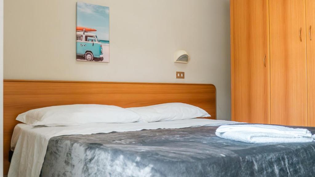 Postel nebo postele na pokoji v ubytování Hotel Fattori