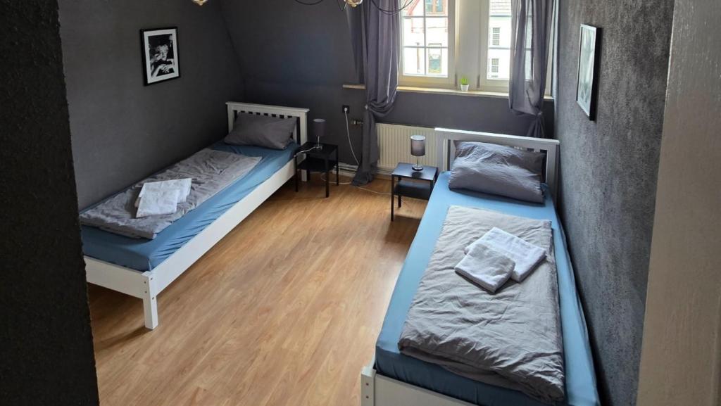 Postel nebo postele na pokoji v ubytování work & stay house in Linz