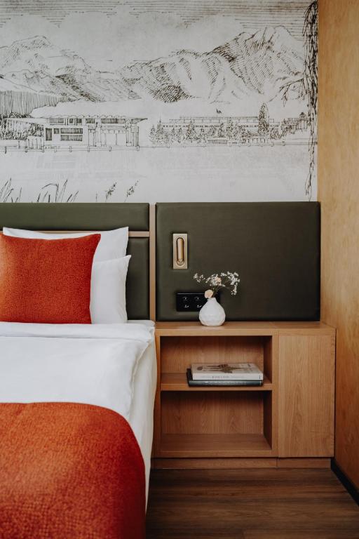 Postel nebo postele na pokoji v ubytování AMERON Luzern Hotel Flora