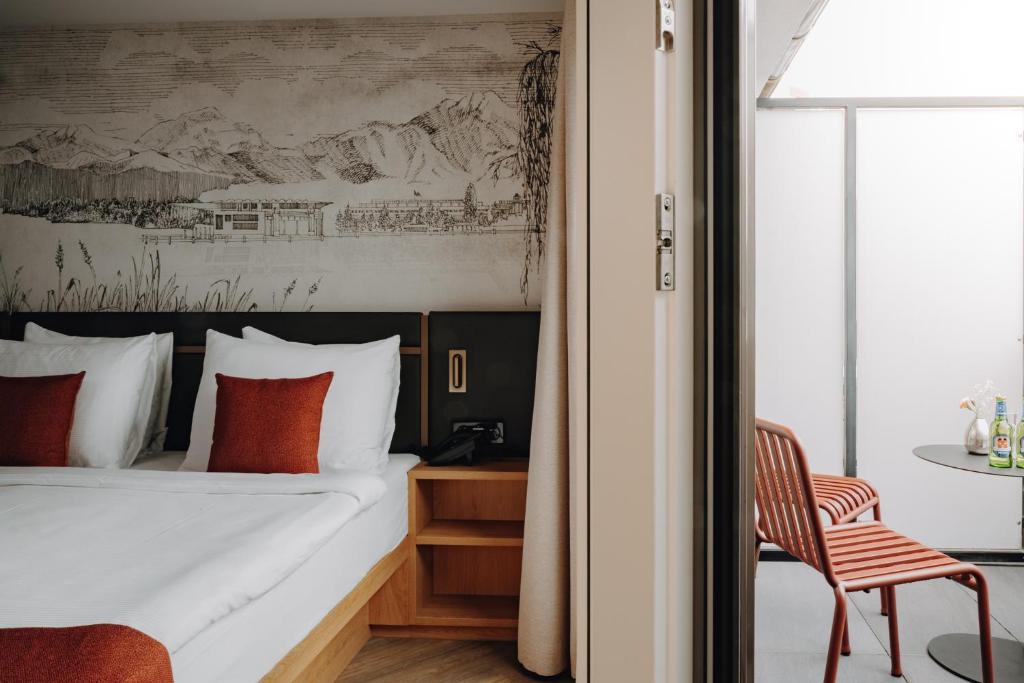 Postel nebo postele na pokoji v ubytování AMERON Luzern Hotel Flora