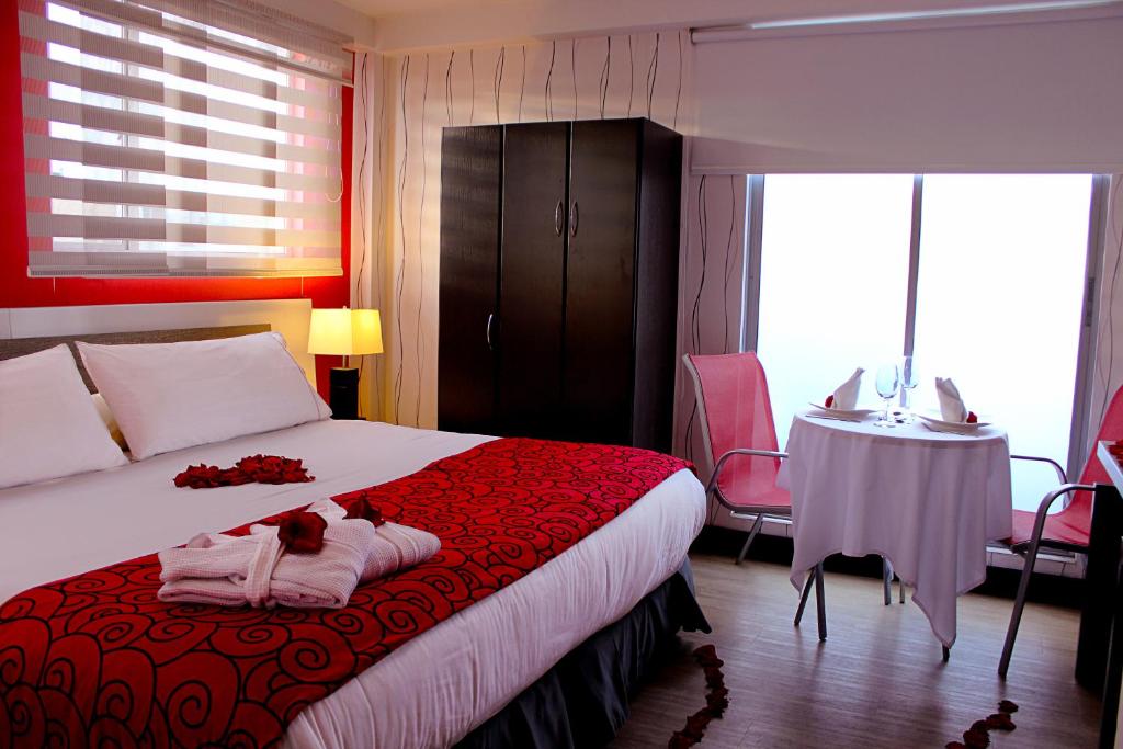 Postel nebo postele na pokoji v ubytování Hotel Bogota Expocomfort - Embajada Americana