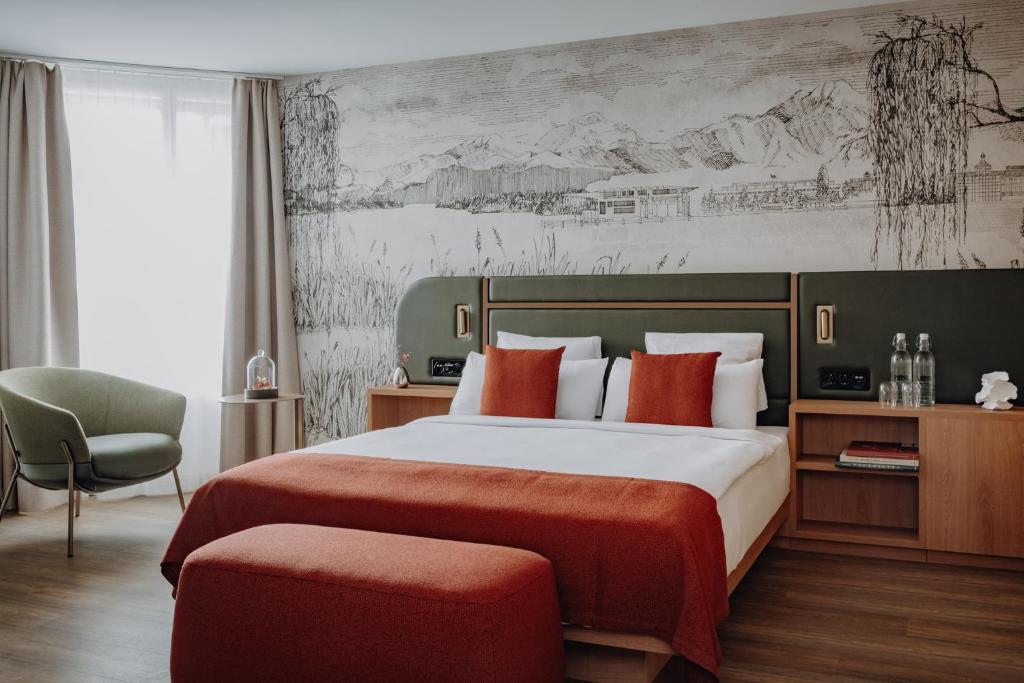 Postel nebo postele na pokoji v ubytování AMERON Luzern Hotel Flora