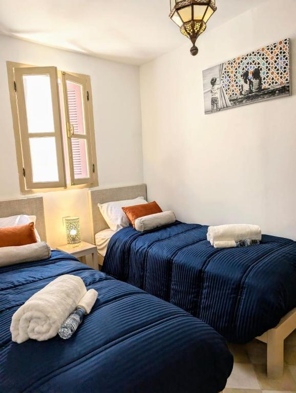 Postel nebo postele na pokoji v ubytování Bleu de Tanger