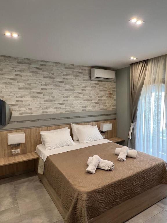 Postel nebo postele na pokoji v ubytování Villa Harmony