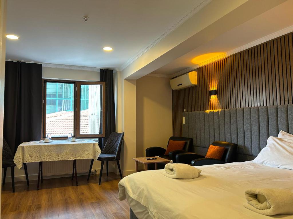 Postel nebo postele na pokoji v ubytování Naila Hotel