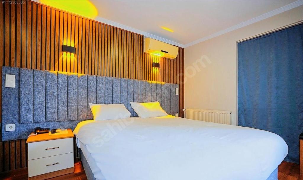 Postel nebo postele na pokoji v ubytování Naila Hotel
