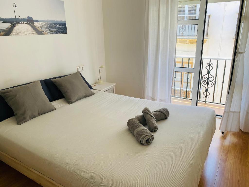 Posteľ alebo postele v izbe v ubytovaní Ático Cádiz Centro