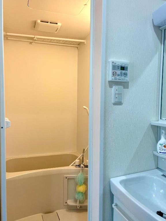 Koupelna v ubytování IMA Guesthouse 飛田新地イマ民宿