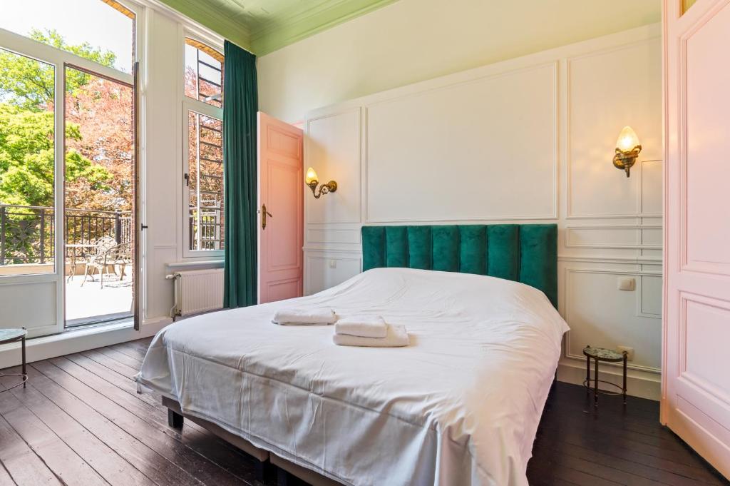 Postel nebo postele na pokoji v ubytování Boutique B&B Baron Osy