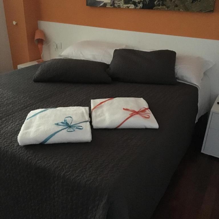 Letto o letti in una camera di amaranto bnb