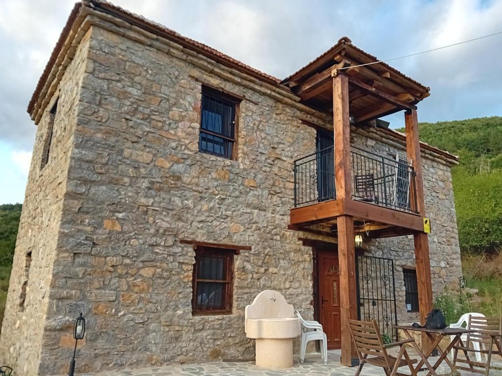 a house with a balcony in front of it at Arbinovo Lodge in Ohrid