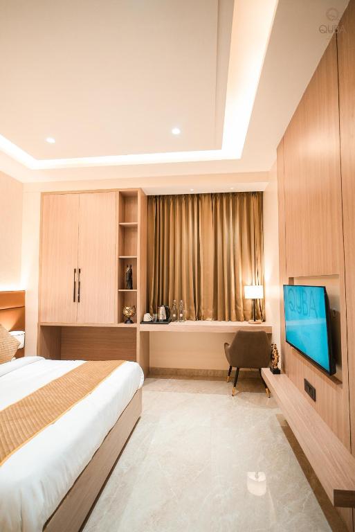 TV a/nebo společenská místnost v ubytování Hotel QUBA