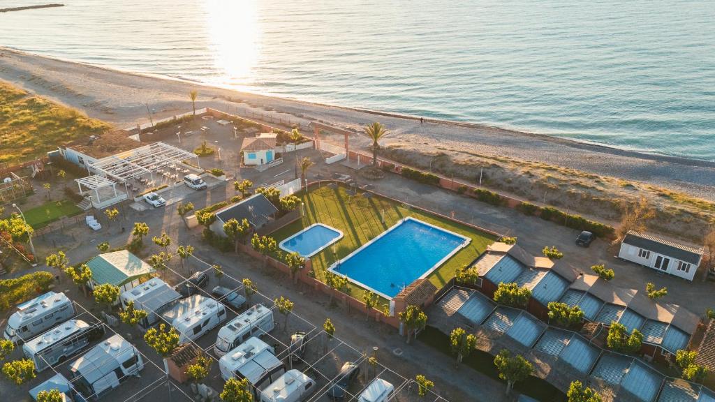 an aerial view of a parking lot next to the water at Tres Estrellas Mediterráneo in Xilxes