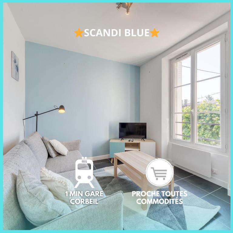 un salon avec un canapé et une table dans l'établissement Le Scandi Bleu - Proche Gare Corbeil - Cozy Houses, à Corbeil-Essonnes