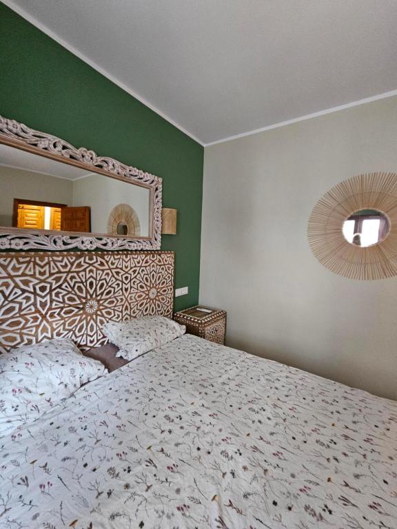 Ένα ή περισσότερα κρεβάτια σε δωμάτιο στο Vera Apartamento Perla Esmeralda