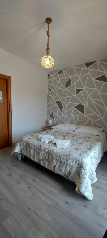 Postel nebo postele na pokoji v ubytování Casa Immacolata Affittacamere
