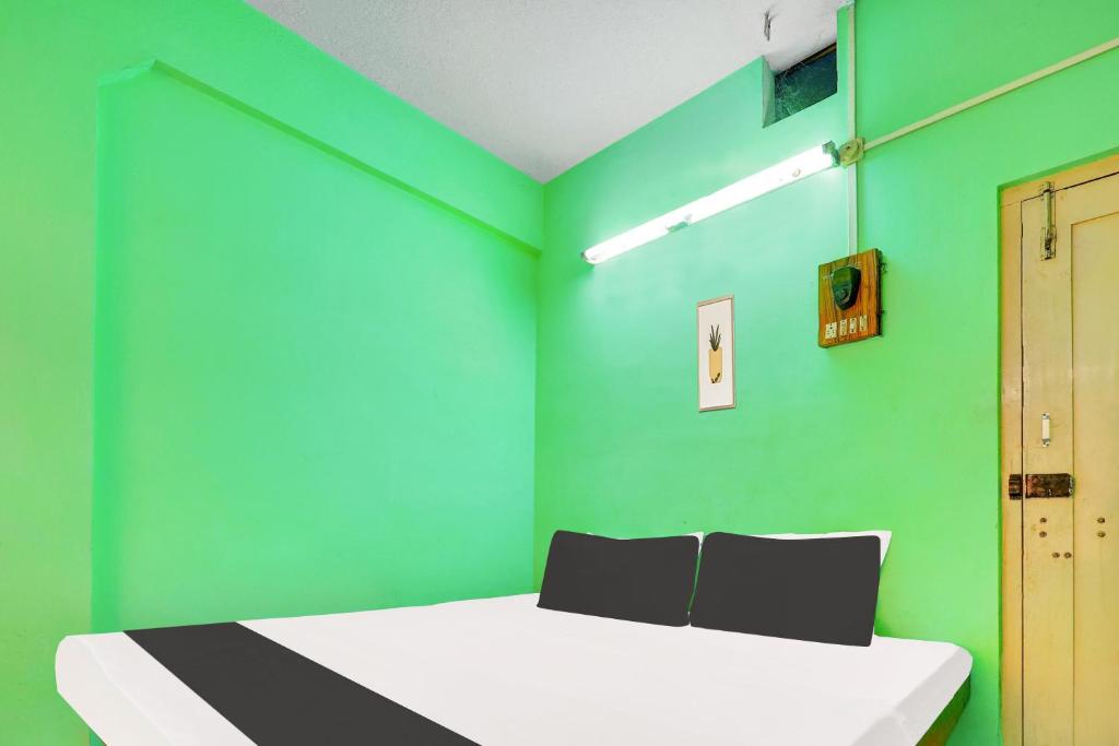 Postel nebo postele na pokoji v ubytování Hotel O RK HOTEL