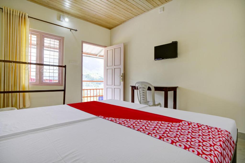 Postel nebo postele na pokoji v ubytování Hotel O Lulu Home