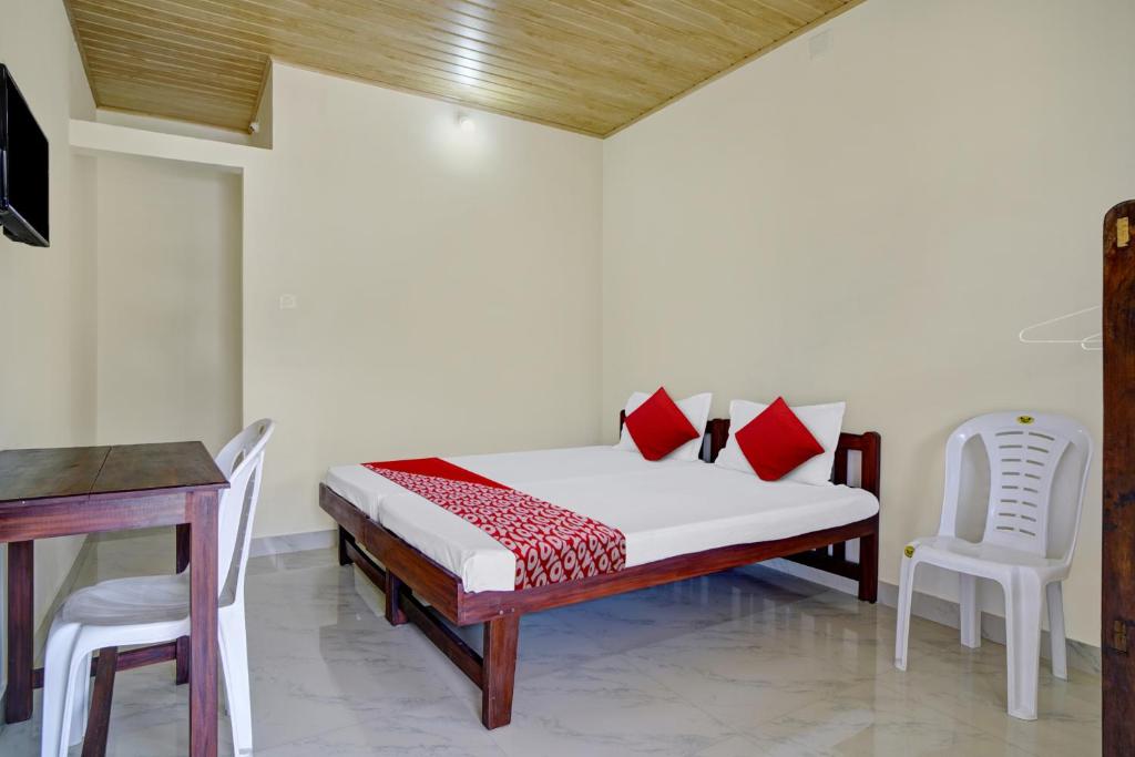 Postel nebo postele na pokoji v ubytování Hotel O Lulu Home