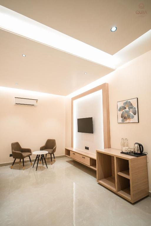 TV a/nebo společenská místnost v ubytování Hotel QUBA