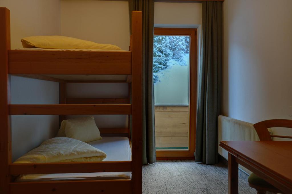 Postel nebo postele na pokoji v ubytování Ferienhotel Iris