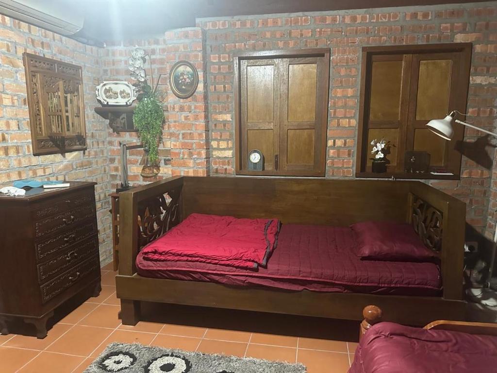 Postel nebo postele na pokoji v ubytování Lelangit Inn