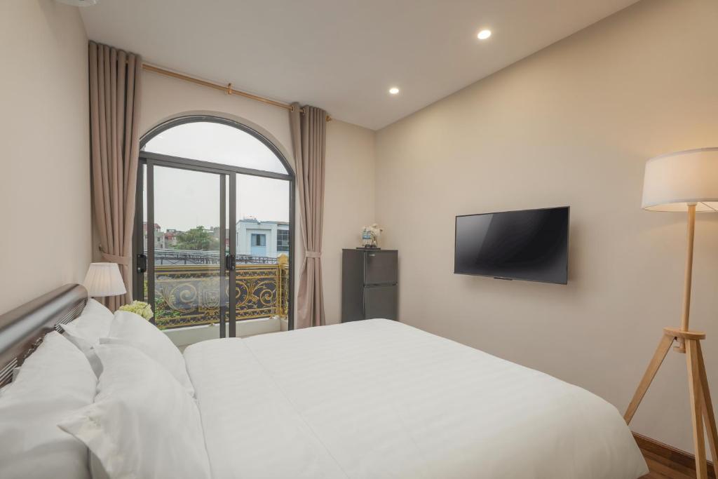 Postel nebo postele na pokoji v ubytování Fuji Apartment Hoàn Kiếm