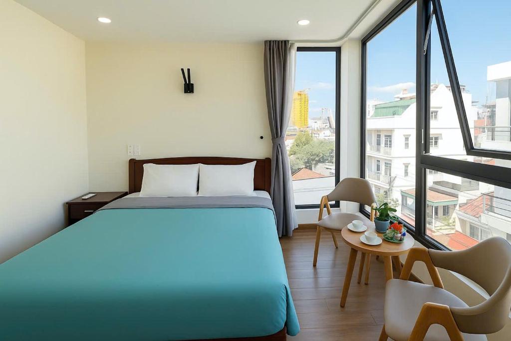 Postel nebo postele na pokoji v ubytování Stars Central Danang