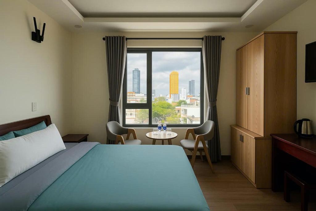 Postel nebo postele na pokoji v ubytování Stars Central Danang