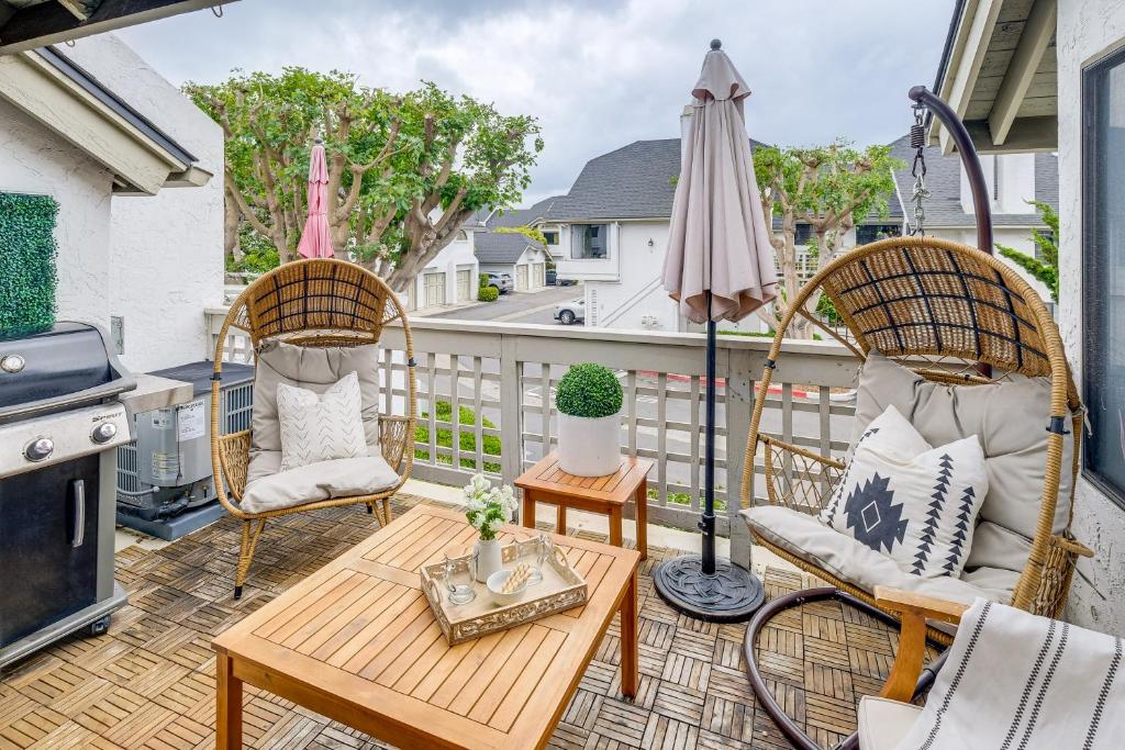 a patio with two chairs and a table and an umbrella at 1 Mi to Coast Family-Friendly Gem in Solana Beach in Solana Beach