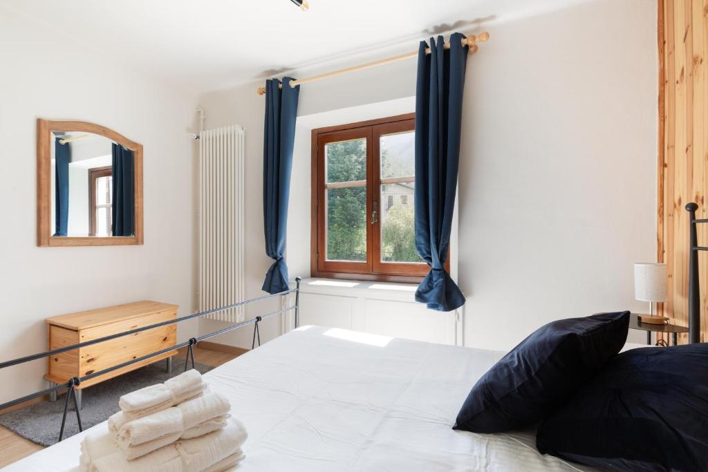 Postel nebo postele na pokoji v ubytování Residence Madamin