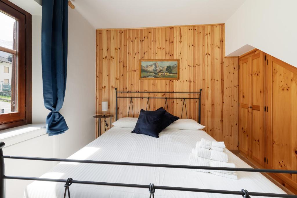 Postel nebo postele na pokoji v ubytování Residence Madamin