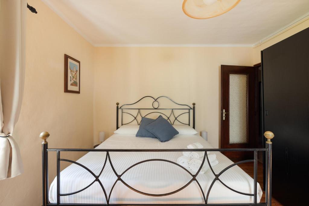 Postel nebo postele na pokoji v ubytování Residence Madamin