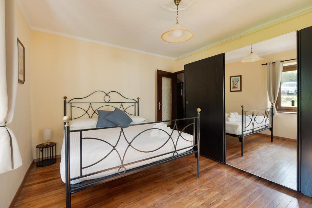 Postel nebo postele na pokoji v ubytování Residence Madamin