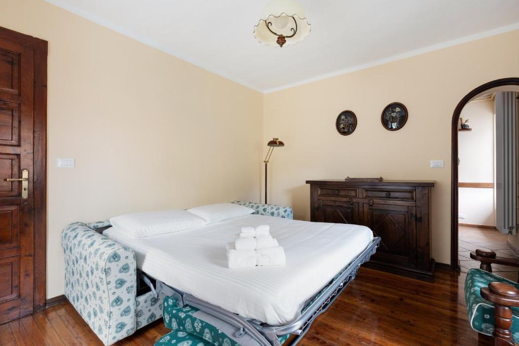 Postel nebo postele na pokoji v ubytování Residence Madamin