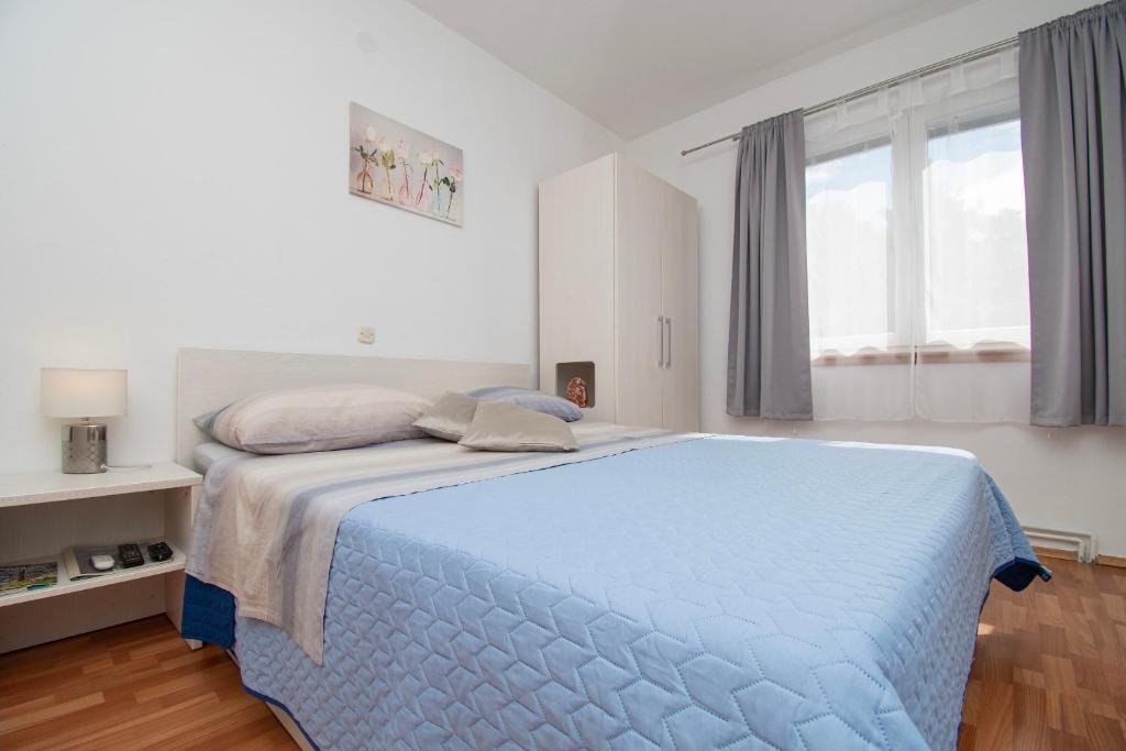 Postel nebo postele na pokoji v ubytování Apartments JoviZe