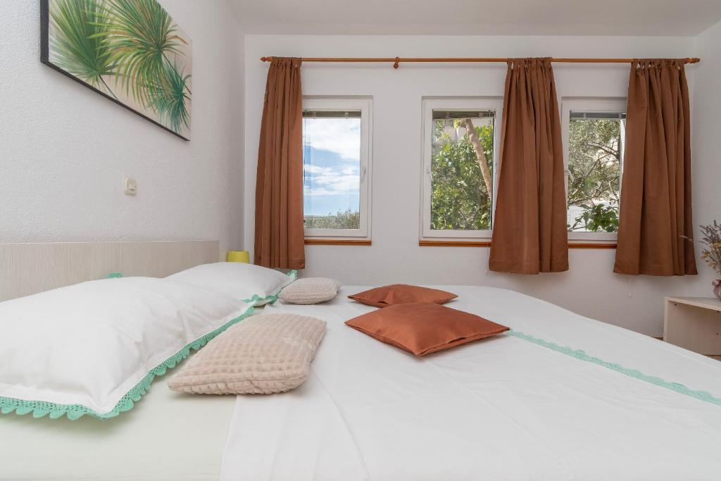 Postel nebo postele na pokoji v ubytování Apartments JoviZe