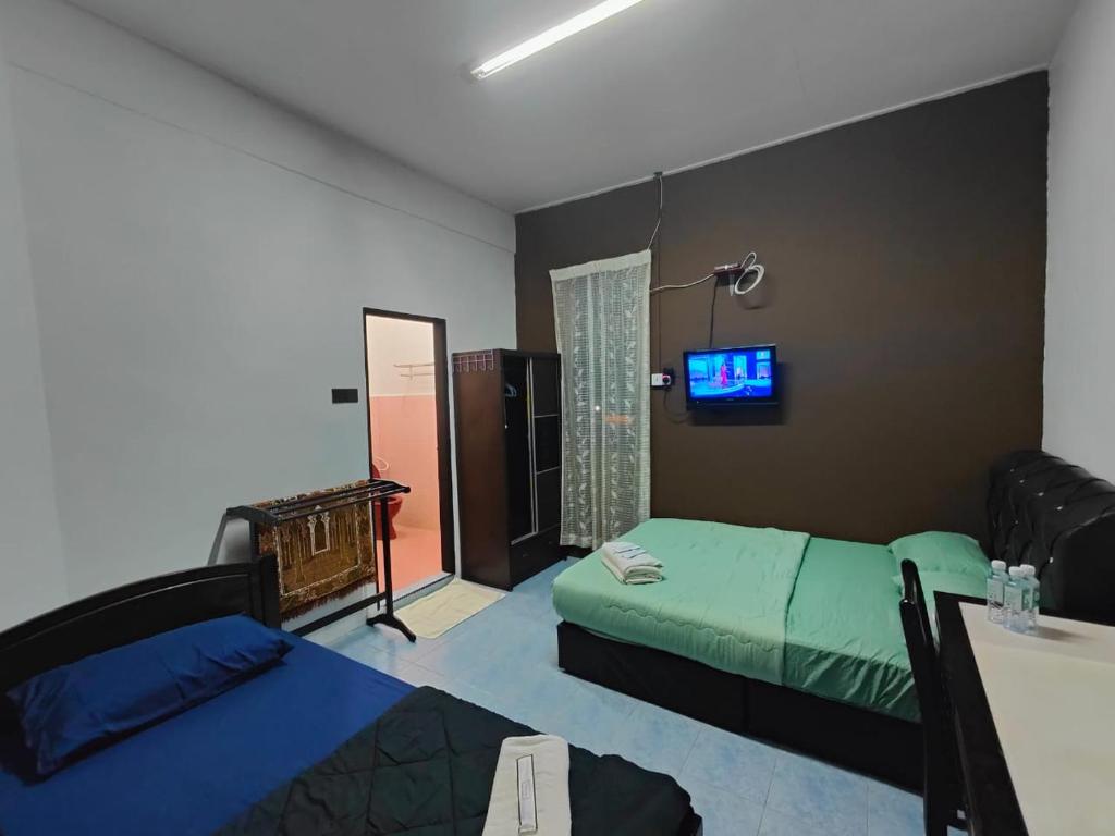 Postel nebo postele na pokoji v ubytování Deummah Guest Room