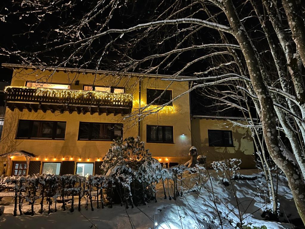 a house in the snow at night at Rivendell I3 in Monschau