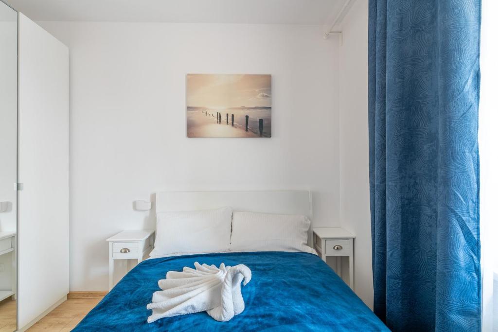 Postel nebo postele na pokoji v ubytování Feniks Seaside Apartment with Pool & near Beach