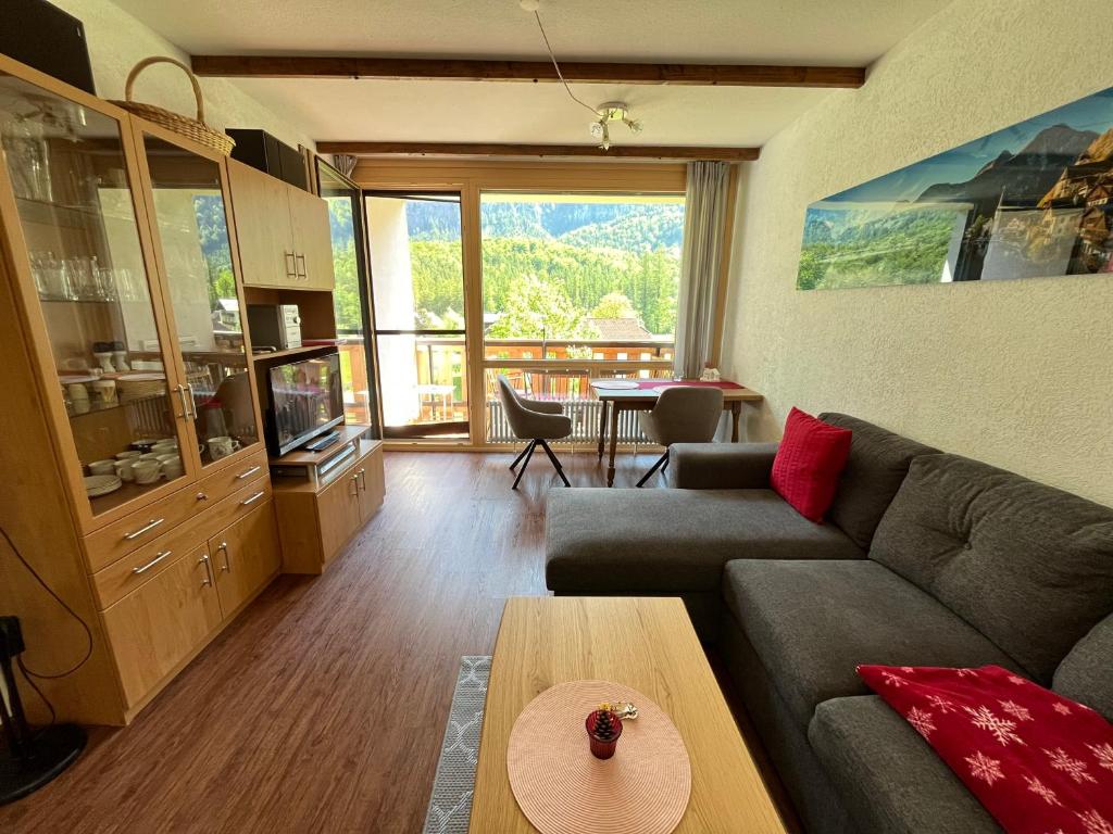 a living room with a couch and a table at Apartment Elisabeth in Obertraun