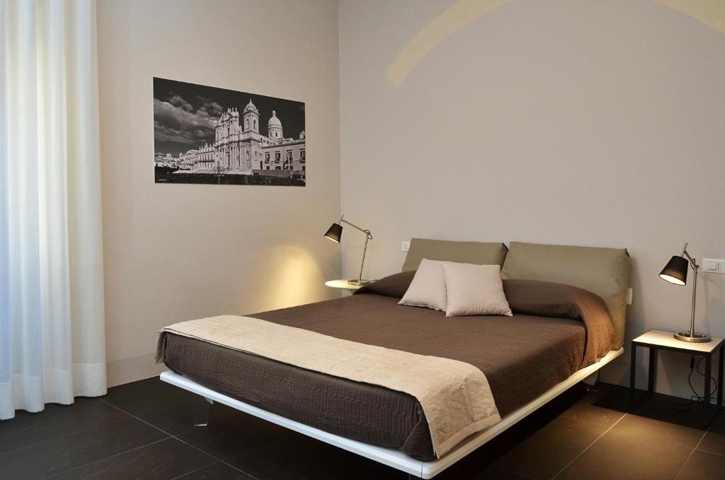 Postel nebo postele na pokoji v ubytování B&B Vicere Speciale