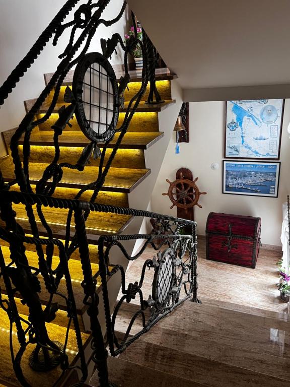 a staircase in a house with a yellow carpet at Szyper 2 in Jastarnia