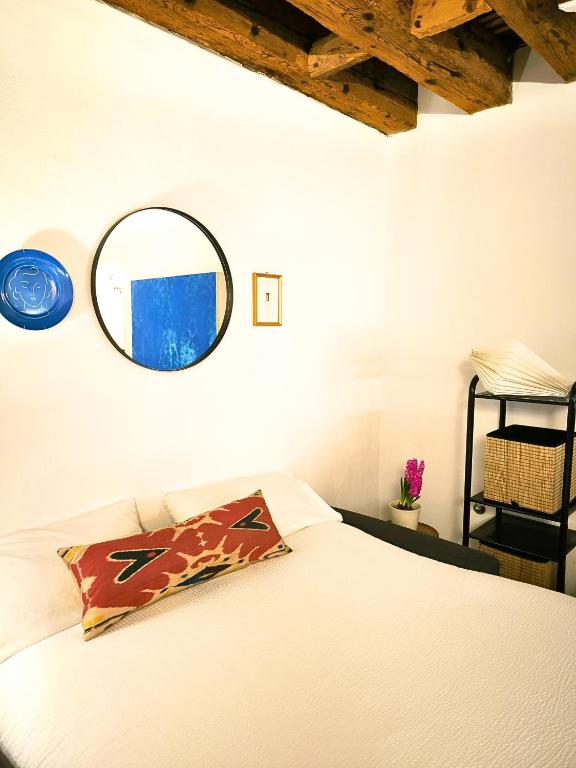 A bed or beds in a room at Arena al Palio